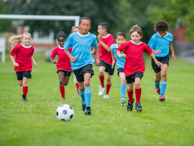 child playing football