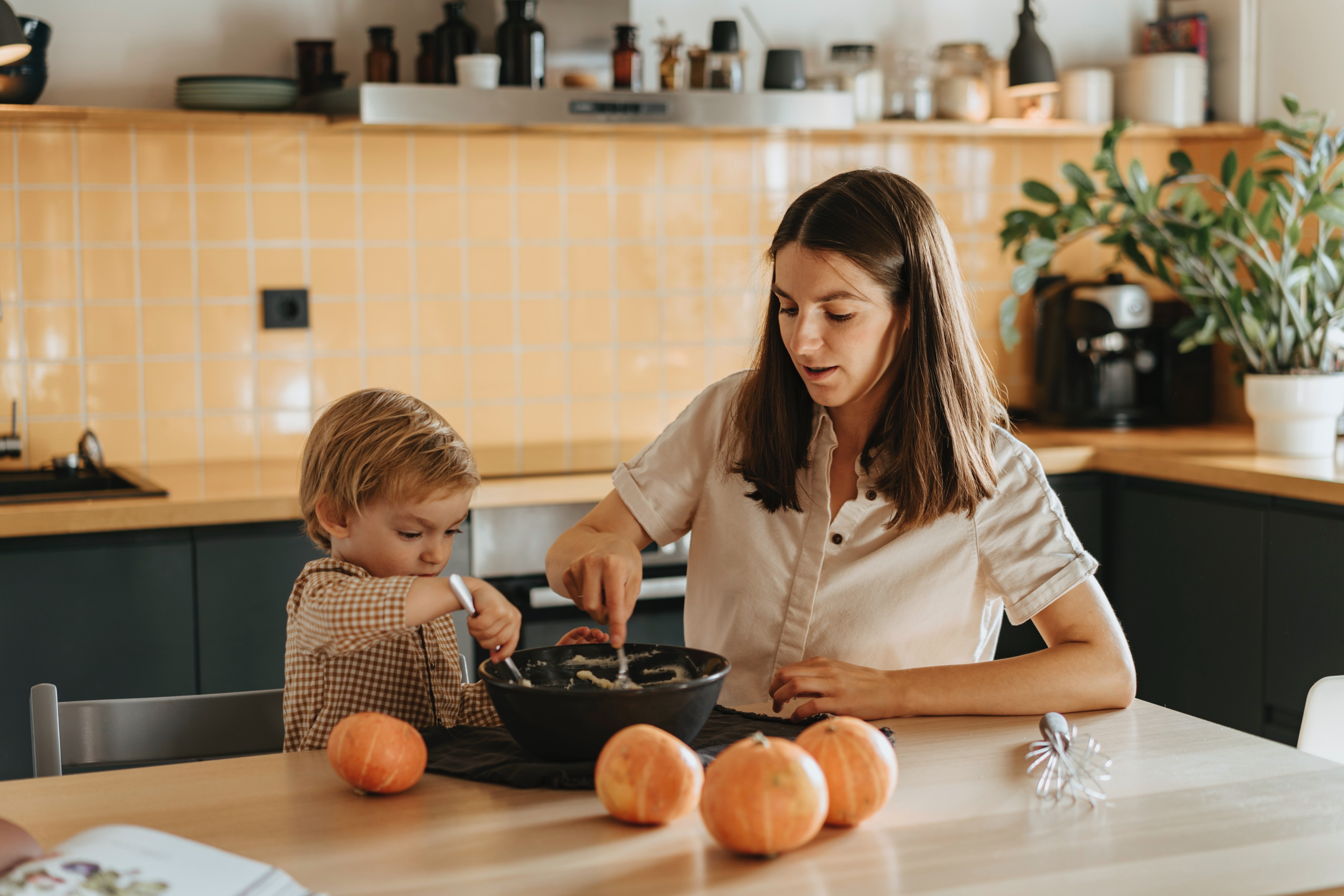 mom and kid bake together