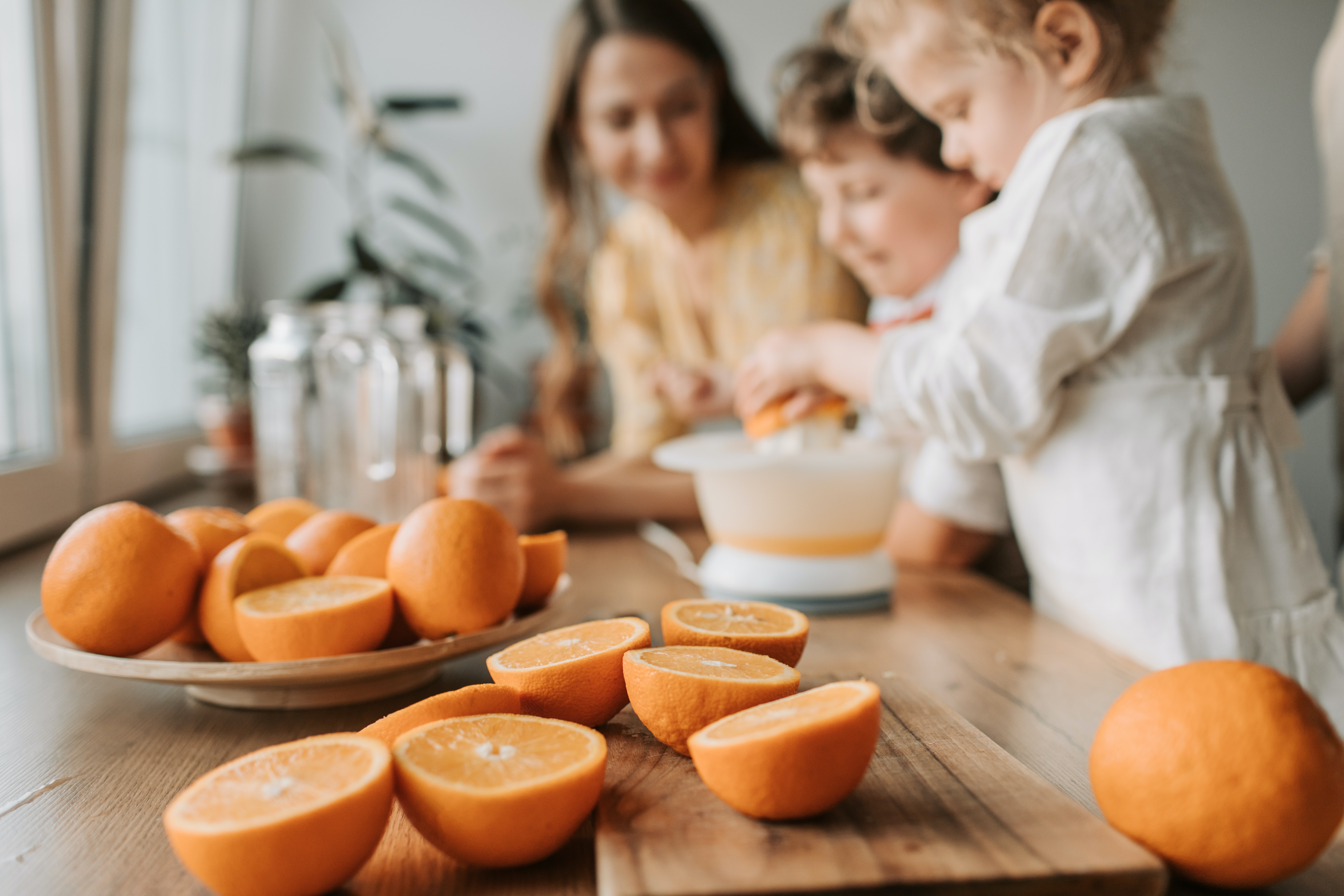 photo by vlada karpovich: https://www.pexels.com/photo/kids-making-juice-with-sliced-orange-4617258/
